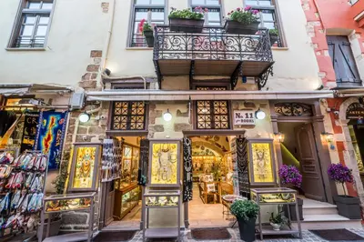 a shop in the city of lyon with a balcony at 11City Rooms in Chania Town