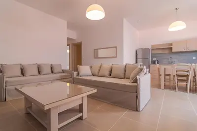 a living room with a couch and a table at Villa-Palaiochora in Palaiochóra