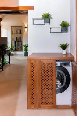 a washer and dryer in a living room at Alia Stone Villa-Ideal for families-Heated pool in Nohia