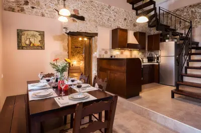 a kitchen and a dining room with a table and chairs at Alia Stone Villa-Ideal for families-Heated pool in Nohia