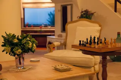 a living room with a chess board on a table at Villa Allegra in Korfalónas