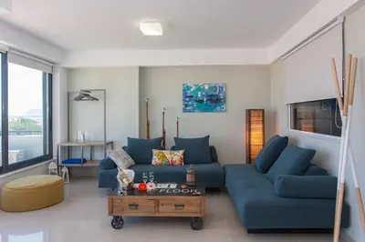 a living room with blue couches and a table at Stefan's City Loft in Chania Town
