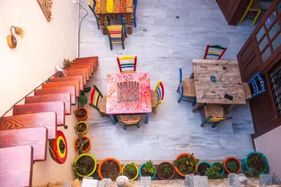 an overhead view of a restaurant with tables and chairs at Poco Loco Bed & Breakfast in Chania Town