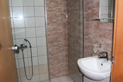 a bathroom with a shower and a sink at My Rooms in Chania Town