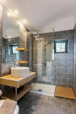 a bathroom with a sink and a shower at Aoria Villa By Hope Estate in Arménoi