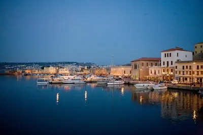 a group of boats docked in a harbor at night at C&M Residence Chania Old Town in Chania Town