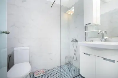 a bathroom with a shower and a toilet and a sink at Irini House in Arménoi