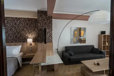 a living room with a couch and a bed at Horizon Deluxe House in Chania Town