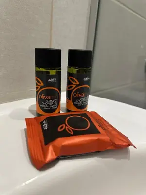 two bottles of hair products sitting on a counter at Electra Studios in Gerani Chanion
