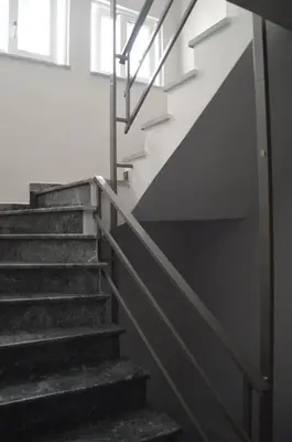 a set of stairs in a building with white walls at Christini Apartment in Chania Town