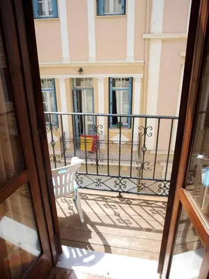 a view of a balcony with a white bench at Hera Studios in Chania Town