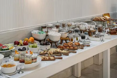 a buffet with many different types of food on a table at Avra City Boutique Hotel in Chania Town