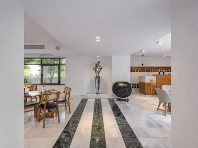a living room with a table and chairs at Avra City Boutique Hotel in Chania Town
