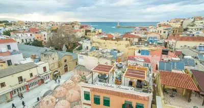 an aerial view of a city with buildings and the ocean at Nikolas Rooms in Chania Town