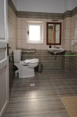 a bathroom with a toilet and a sink at Metohi Georgila in Maleme