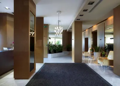a lobby with a large rug in a building at Irida Hotel in Chania Town