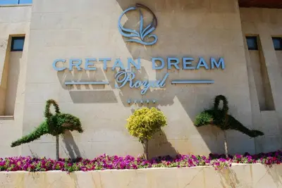 a sign for the greenan dream resort in front of a building at Cretan Dream Resort & Spa in Stalos