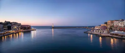 a large body of water with buildings and a lighthouse at Residenza Vranas Boutique Hotel in Chania Town