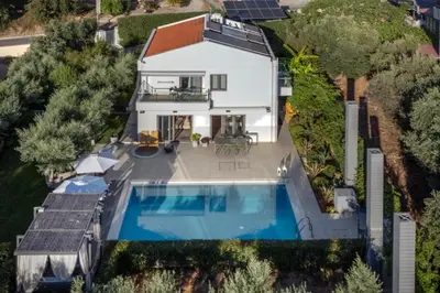 an aerial view of a house with a swimming pool at Sunlight Breeze Villa in Chania Town