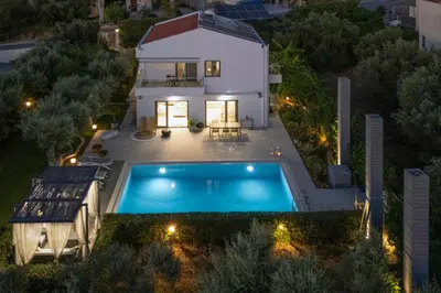 an aerial view of a house with a swimming pool at Sunlight Breeze Villa in Chania Town