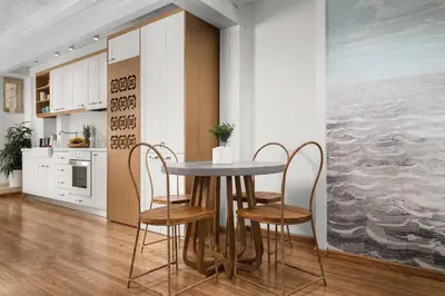 a kitchen with a table and chairs in a room at Aeria Apartments in Chania Town