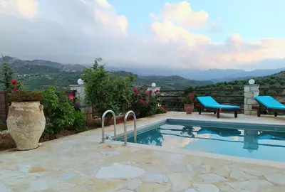 a swimming pool with a view of the mountains at Little House on the Prairie - Chania in Katokhórion