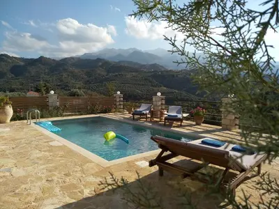 a swimming pool with a ball in the water at Little House on the Prairie - Chania in Katokhórion