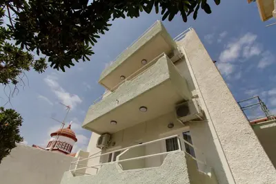 a building with a tower on top of it at Kissamia - Self Check In Only - Next to Night Clubs in Kissamos