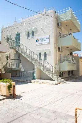 a building with stairs on the side of it at Kissamia - Self Check In Only - Next to Night Clubs in Kissamos