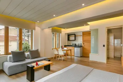 a living room with a couch and a table at Querini Luxury Suites in Chania Town