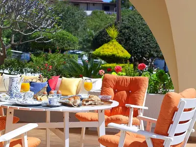 a table and chairs with food and drinks on it at Villa Mare in Tersanas