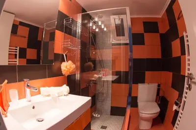 a bathroom with a sink and a toilet at City Square Apartment in Chania Town