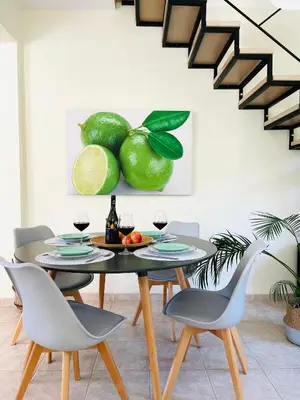a dining room with a table and chairs at Sunny Villa in Kissamos