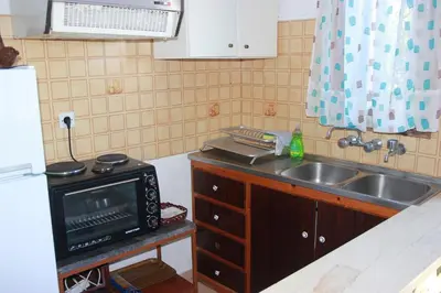 a kitchen with a sink and a microwave at Tasos Cottages in Gerani Chanion