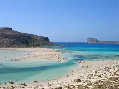 a group of people on a beach near the ocean at Iridanos Villa in Kissamos