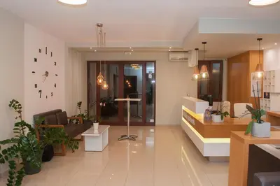 a living room with potted plants and a lobby at Kallitsakis Beach in Plataniás