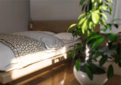 a bedroom with a bed and a potted plant at Iskios Villas in Agia Marina Nea Kydonias