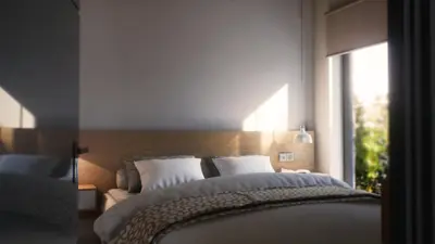 a bedroom with a large bed and a window at Iskios Villas in Agia Marina Nea Kydonias