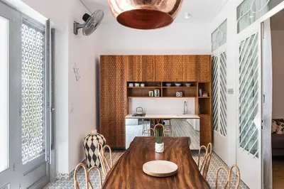a dining room with a wooden table and chairs at Nyx Chic Manor in Chania Town