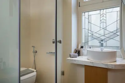 a bathroom with a sink and a window at Consolato Boutique in Chania Town