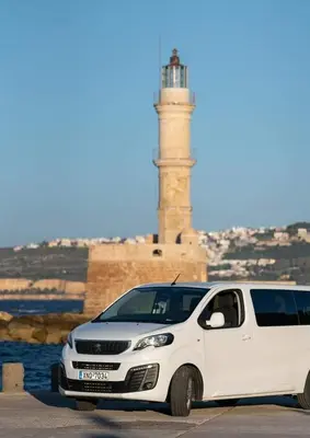 a white van parked in front of a lighthouse at Vaggelio House in Chania Town