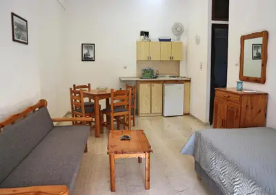 a living room with a couch and a table at Oliaria Apartments in Plataniás