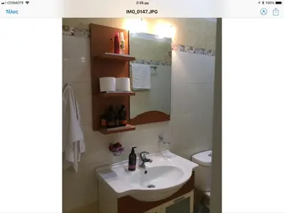 a bathroom with a sink and a mirror at Villa Nopigia Somina in Kissamos