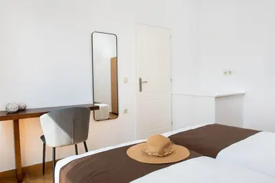a hat sitting on a bed in a bedroom at Villa Tramonto - Falasarna in Falasarna