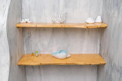 a wooden shelf on a wall with some items on it at Villa Agrithea in Kissamos