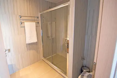 a shower with a glass door in a bathroom at Mare Civitas Apartments in Chania Town