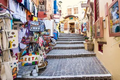 a narrow street with stairs and shops in an alley at Mare Civitas Apartments in Chania Town
