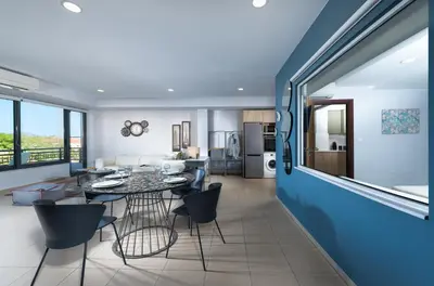 a dining room and living room with a table and chairs at Stefan's City Hub in Chania Town