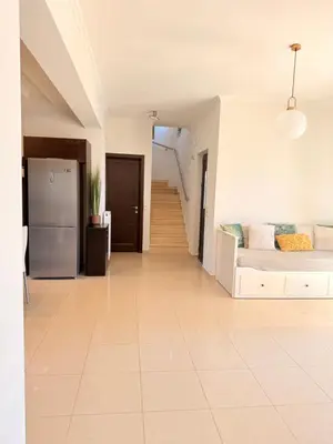 a large living room with a bed and a refrigerator at Villa Fanouris in Chania Town