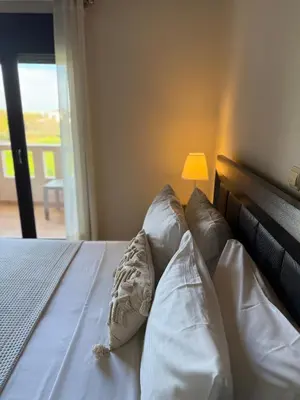 a bedroom with a bed with three pillows on it at Villa Fanouris in Chania Town